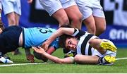 20 March 2023; Matthew Haugh of St Michael's College dives over to score his side's second try despite the tackle of Dylan Lord of Belvedere College during the Bank of Ireland Leinster Rugby Schools Junior Cup semi-final replay match between Belvedere College and St Michael’s College at Energia Park in Dublin. Photo by Ben McShane/Sportsfile