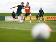 20 March 2023; Jayson Molumby is tackled by Jason Knight, right, during a Republic of Ireland training session at the FAI National Training Centre in Abbotstown, Dublin. Photo by Stephen McCarthy/Sportsfile