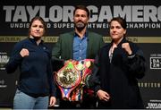 20 March 2023; Katie Taylor, left, and Chantelle Cameron face off with promoter Eddie Hearn, centre, after a media conference, held at the Mansion House in Dublin, ahead of their undisputed super lightweight championship fight on May 20th at the 3Arena in Dublin. Photo by David Fitzgerald/Sportsfile