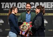 20 March 2023; Katie Taylor, left, and Chantelle Cameron face off with promoter Eddie Hearn, centre, after a media conference, held at the Mansion House in Dublin, ahead of their undisputed super lightweight championship fight on May 20th at the 3Arena in Dublin. Photo by David Fitzgerald/Sportsfile