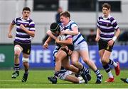 20 March 2023; Daniel McKenna of Terenure College is tackled by Charlie Martin, left, and Louis Magee of Blackrock College during the Bank of Ireland Leinster Rugby Schools Junior Cup semi-final replay match between Terenure College and Blackrock College at Energia Park in Dublin. Photo by Ben McShane/Sportsfile