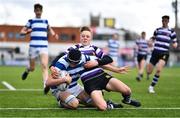 20 March 2023; Geoffrey Wall of Blackrock College scores his side's first try despite the tackle of Geoff O'Sullivan of Terenure College during the Bank of Ireland Leinster Rugby Schools Junior Cup semi-final replay match between Terenure College and Blackrock College at Energia Park in Dublin. Photo by Ben McShane/Sportsfile