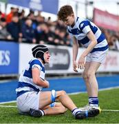 20 March 2023; Geoffrey Wall of Blackrock College is assisted by teammate Cael McCloskey, right, after picking up an injury while scoring their side's first try during the Bank of Ireland Leinster Rugby Schools Junior Cup semi-final replay match between Terenure College and Blackrock College at Energia Park in Dublin. Photo by Ben McShane/Sportsfile