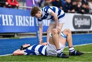 20 March 2023; Geoffrey Wall of Blackrock College is assisted by teammate Cael McCloskey, right, after picking up an injury while scoring their side's first try during the Bank of Ireland Leinster Rugby Schools Junior Cup semi-final replay match between Terenure College and Blackrock College at Energia Park in Dublin. Photo by Ben McShane/Sportsfile