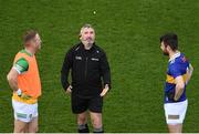 18 March 2023; Referee James Molloy tosses a coin between the two captains, Declan Hogan, left, of Offaly and Shane O'Connell of Tipperary, before the Allianz Football League Division 3 match between Tipperary and Offaly at FBD Semple Stadium in Thurles, Tipperary. Photo by Ray McManus/Sportsfile