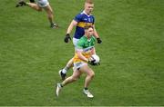 18 March 2023; Lee Pearson of Offaly in action against Teddy Doyle of Tipperary during the Allianz Football League Division 3 match between Tipperary and Offaly at FBD Semple Stadium in Thurles, Tipperary. Photo by Ray McManus/Sportsfile