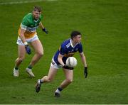 18 March 2023; Conor Cadell of Tipperary in action against Cian Donohoe of Offaly during the Allianz Football League Division 3 match between Tipperary and Offaly at FBD Semple Stadium in Thurles, Tipperary. Photo by Ray McManus/Sportsfile