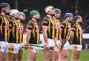 19 March 2023; Paddy Deegan of Kilkenny, centre, with his teammates for the playing of Amhrán na bhFiann before the Allianz Hurling League Division 1 Group B match between Waterford and Kilkenny at UPMC Nowlan Park in Kilkenny. Photo by Piaras Ó Mídheach/Sportsfile