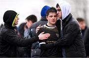 15 March 2023; Ronan Murphy of Holy Rosary College is consoled after his side's defeat in the FAI Schools Dr Tony O'Neill Senior National Cup Final match between Holy Rosary College Mountbellew and Wexford CBS at AUL Complex in Clonshaugh, Dublin. Photo by Piaras Ó Mídheach/Sportsfile