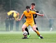 15 March 2023; Connor Mackey of Wexford CBS in action against Tiarnán Proulx of Holy Rosary College during the FAI Schools Dr Tony O'Neill Senior National Cup Final match between Holy Rosary College Mountbellew and Wexford CBS at AUL Complex in Clonshaugh, Dublin. Photo by Piaras Ó Mídheach/Sportsfile