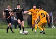 15 March 2023; Ciaran Mulhern of Holy Rosary College in action against Darragh Byrne Maloney and Tadhg Brohan, 5, of Wexford CBS during the FAI Schools Dr Tony O'Neill Senior National Cup Final match between Holy Rosary College Mountbellew and Wexford CBS at AUL Complex in Clonshaugh, Dublin. Photo by Piaras Ó Mídheach/Sportsfile