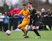 15 March 2023; Tiarnán Proulx of Holy Rosary College in action against Darragh Byrne Maloney of Wexford CBS during the FAI Schools Dr Tony O'Neill Senior National Cup Final match between Holy Rosary College Mountbellew and Wexford CBS at AUL Complex in Clonshaugh, Dublin. Photo by Piaras Ó Mídheach/Sportsfile