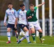 22 March 2023; Edward McJannet of Republic of Ireland in action against Šimon Micuda of Slovakia, 2, during the UEFA European Under-19 Championship Elite Round match between Republic of Ireland and Slovakia at Ferrycarrig Park in Wexford. Photo by Piaras Ó Mídheach/Sportsfile