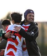 22 March 2023; Tulimafuaimahola Tupou, right, and Yoshitaka Yazaki of Japan after their side's victory in the Under-19 Rugby International match between Ireland and Japan at Lakelands Park in Dublin. Photo by Harry Murphy/Sportsfile