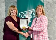22 March 2023; Sally Rafferty from St Brenda's Camogie Club, Armagh, left, receives her award from Federation of Irish Sport Chairperson Clare McGrath during the Volunteers in Sport Awards at The Crowne Plaza in Blanchardstown, Dublin. Photo by Sam Barnes/Sportsfile