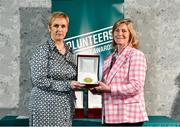 22 March 2023; Jean Courtney from Killarney Valley AC, Kerry, left, receives her award from Federation of Irish Sport Chairperson Clare McGrath during the Volunteers in Sport Awards at The Crowne Plaza in Blanchardstown, Dublin. Photo by Sam Barnes/Sportsfile