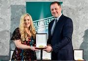 22 March 2023; Eimear Doonan from Fenagh GAA, Leitrim, receives her award from Minister of State for Sport and Physical Education, Thomas Byrne TD, during the Volunteers in Sport Awards at The Crowne Plaza in Blanchardstown, Dublin. Photo by Sam Barnes/Sportsfile