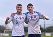 22 March 2023; Slovakia players Dávid Ovšonka, left, and Samuel Bagín celebrate after their side's victory in the UEFA European Under-19 Championship Elite Round match between Republic of Ireland and Slovakia at Ferrycarrig Park in Wexford. Photo by Piaras Ó Mídheach/Sportsfile