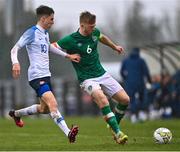 22 March 2023; Edward McJannet of Republic of Ireland in action against Mário Sauer of Slovakia during the UEFA European Under-19 Championship Elite Round match between Republic of Ireland and Slovakia at Ferrycarrig Park in Wexford. Photo by Piaras Ó Mídheach/Sportsfile