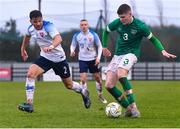 22 March 2023; Alex Murphy of Republic of Ireland in action against Šimon Micuda of Slovakia during the UEFA European Under-19 Championship Elite Round match between Republic of Ireland and Slovakia at Ferrycarrig Park in Wexford. Photo by Piaras Ó Mídheach/Sportsfile
