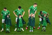 22 March 2023; Republic of Ireland players, form left, Alan Browne, Callum O’Dowda, Evan Ferguson and Michael Obafemi give their walkout jackets to the mascots before the international friendly match between Republic of Ireland and Latvia at Aviva Stadium in Dublin. Photo by Eóin Noonan/Sportsfile