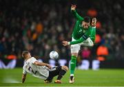 22 March 2023; Matt Doherty of Republic of Ireland is tackled by Vladislavs Sorokins of Latvia during the international friendly match between Republic of Ireland and Latvia at the Aviva Stadium in Dublin. Photo by Seb Daly/Sportsfile