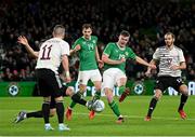 22 March 2023; Evan Ferguson of Republic of Ireland shoots to score his side's second goal during the international friendly match between Republic of Ireland and Latvia at Aviva Stadium in Dublin. Photo by Stephen McCarthy/Sportsfile