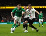 22 March 2023; James McClean of Republic of Ireland in action against Raimonds Krollis of Latvia during the international friendly match between Republic of Ireland and Latvia at Aviva Stadium in Dublin. Photo by Michael P Ryan/Sportsfile