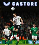 22 March 2023; Arturs Zjuzins of Latvia in action against Mikey Johnston of Republic of Ireland of Republic of Ireland during the international friendly match between Republic of Ireland and Latvia at Aviva Stadium in Dublin. Photo by Michael P Ryan/Sportsfile