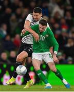 22 March 2023; Troy Parrott of Republic of Ireland in action against Marcis Oss of Latvia during the international friendly match between Republic of Ireland and Latvia at Aviva Stadium in Dublin. Photo by Brendan Moran/Sportsfile