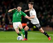 22 March 2023; Janis Ikaunieks of Latvia in action against Callum O’Dowda of Republic of Ireland during the international friendly match between Republic of Ireland and Latvia at Aviva Stadium in Dublin. Photo by Stephen McCarthy/Sportsfile