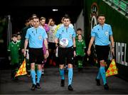 22 March 2023; Referee Andrei Chivulete, centre, and assistant referee's Mihai Marica and George Florin Neacsu lead the teams out for the international friendly match between Republic of Ireland and Latvia at Aviva Stadium in Dublin. Photo by Stephen McCarthy/Sportsfile