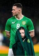 22 March 2023; A young mascot wearing the anthem jacket of Alan Browne of Republic of Ireland during a shower of rain before the international friendly match between Republic of Ireland and Latvia at Aviva Stadium in Dublin. Photo by Stephen McCarthy/Sportsfile