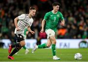 22 March 2023; Callum O'Dowda of Republic of Ireland in action against Janis Ikaunieks of Latvia during the international friendly match between Republic of Ireland and Latvia at Aviva Stadium in Dublin. Photo by Michael P Ryan/Sportsfile