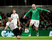 22 March 2023; Will Smallbone of Republic of Ireland in action against Arturs Zjuzins of Latvia during the international friendly match between Republic of Ireland and Latvia at Aviva Stadium in Dublin. Photo by Michael P Ryan/Sportsfile