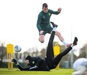 24 March 2023; Goalkeeper Caoimhin Kelleher saves from Jason Knight during a Republic of Ireland training session at the FAI National Training Centre in Abbotstown, Dublin. Photo by Stephen McCarthy/Sportsfile