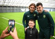 24 March 2023; The Republic of Ireland team granted the wish of 10-year-old Tyler Breen Somers, from Inchicore, Dublin, by welcoming him to training at the National Indoor Arena on the Sport Ireland Campus in Dublin. Tyler pictured with Republic of Ireland's Jeff Hendrick, left, and John Egan, underwent a bone marrow transplant, 3 years ago, and has recovered from acute lymphoblastic leukaemia. His wish was aided by Make-A-Wish Ireland. Photo by Stephen McCarthy/Sportsfile