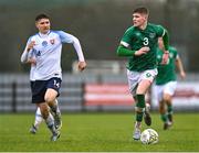 22 March 2023; Alex Murphy of Republic of Ireland in action against Ján Murgaš of Slovakia during the UEFA European Under-19 Championship Elite Round match between Republic of Ireland and Slovakia at Ferrycarrig Park in Wexford. Photo by Piaras Ó Mídheach/Sportsfile