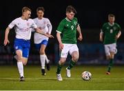 24 March 2023; Brian Cunningham of Republic of Ireland in action against Jacob Towns of England during the Under-18 Schools Cententary Shield International match between Republic of Ireland and England at Athlone Town Stadium in Westmeath. Photo by Piaras Ó Mídheach/Sportsfile