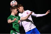 24 March 2023; Peter Grogan of Republic of Ireland in action against George Wilkinson of England during the Under-18 Schools Cententary Shield International match between Republic of Ireland and England at Athlone Town Stadium in Westmeath. Photo by Piaras Ó Mídheach/Sportsfile