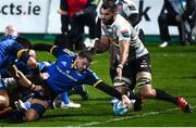 24 March 2023; Max Deegan of Leinster dives over to score his side's fourth try despite the tackle of Ruben van Heerden of DHL Stormers during the United Rugby Championship match between Leinster and DHL Stormers at the RDS Arena in Dublin. Photo by Stephen McCarthy/Sportsfile