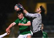 24 March 2023; England goalkeeper James Taylor in action against Brian Cunningham of Republic of Ireland during the Under-18 Schools Cententary Shield International match between Republic of Ireland and England at Athlone Town Stadium in Westmeath. Photo by Piaras Ó Mídheach/Sportsfile