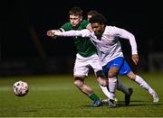 24 March 2023; Peter Grogan of Republic of Ireland in action against Tyrese Hughes of England during the Under-18 Schools Cententary Shield International match between Republic of Ireland and England at Athlone Town Stadium in Westmeath. Photo by Piaras Ó Mídheach/Sportsfile
