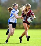 25 March 2023; Aobh McGibbon of St Ronan's College in action against Aoibheann Birchall of Maynooth during the Lidl LGFA Post Primary Junior B Final match between Maynooth Educate Together, Kildare, and St Ronan's College Lurgan, Armagh, at the GAA National Games Development Centre in Abbotstown, Dublin. Photo by Ben McShane/Sportsfile
