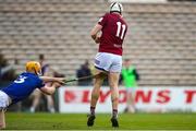 25 March 2023; Joseph Boyle of Westmeath shoots to score his side's first goal despite the attention of Padraig Delaney of Laois during the Allianz Hurling League Division 1 Relegation Play-Off match between Westmeath and Laois at FBD Semple Stadium in Thurles, Tipperary. Photo by Michael P Ryan/Sportsfile