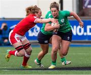 25 March 2023; Enya Breen of Ireland is tackled by Abbie Fleming of Wales during the TikTok Women's Six Nations Rugby Championship match between Wales and Ireland at Cardiff Arms Park in Cardiff, Wales. Photo by Mark Lewis/Sportsfile