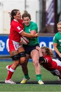 25 March 2023; Enya Breen of Ireland is tackled by Georgia Evans and Abbie Fleming of Wales during the TikTok Women's Six Nations Rugby Championship match between Wales and Ireland at Cardiff Arms Park in Cardiff, Wales. Photo by Mark Lewis/Sportsfile
