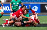 25 March 2023; Enya Breen of Ireland is tackled by Georgia Evans and Abbie Fleming of Wales during the TikTok Women's Six Nations Rugby Championship match between Wales and Ireland at Cardiff Arms Park in Cardiff, Wales. Photo by Mark Lewis/Sportsfile