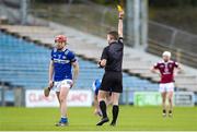 25 March 2023; Fiachra C Fennell of Laois is shown a yellow card by referee Sean Stack during the Allianz Hurling League Division 1 Relegation Play-Off match between Westmeath and Laois at FBD Semple Stadium in Thurles, Tipperary. Photo by Michael P Ryan/Sportsfile
