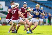 25 March 2023; Ian Shanahan of Laois in action against Westmeath players Padraic Dunne, and Kevin Regan during the Allianz Hurling League Division 1 Relegation Play-Off match between Westmeath and Laois at FBD Semple Stadium in Thurles, Tipperary. Photo by Michael P Ryan/Sportsfile